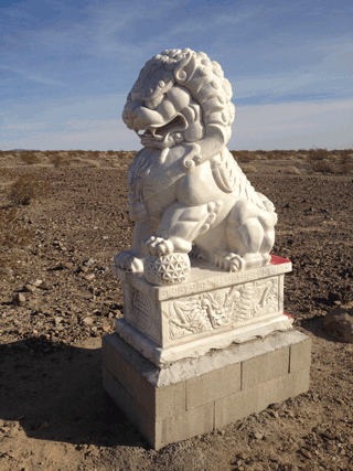 Two Chinese guardian lion "Fu Dog" statues in the middle of nowhere, near Amboy, CA. (one shown)